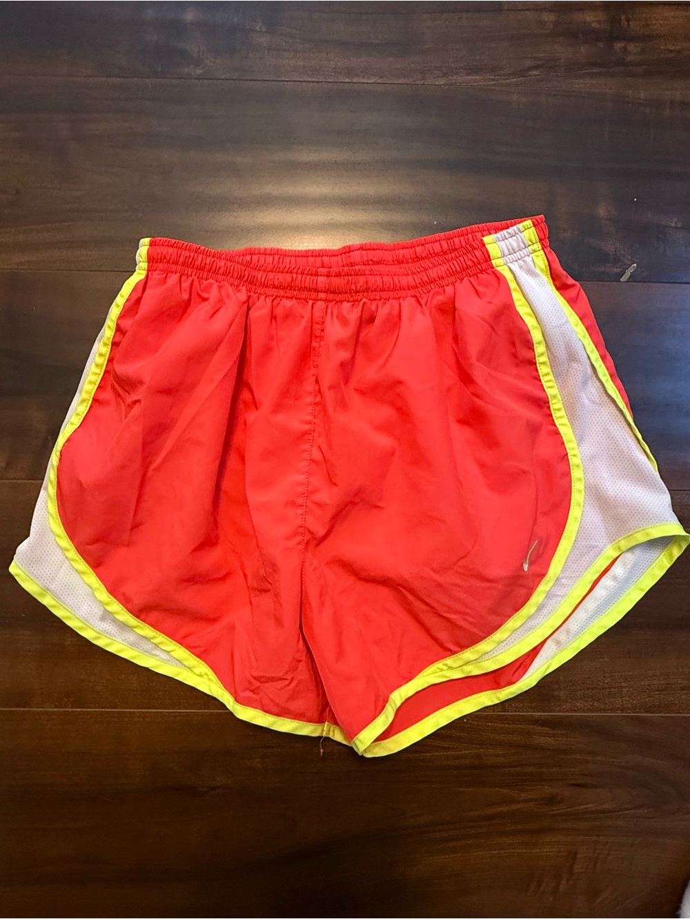 Nike Women's Red Athletic Shorts with Yellow Trim